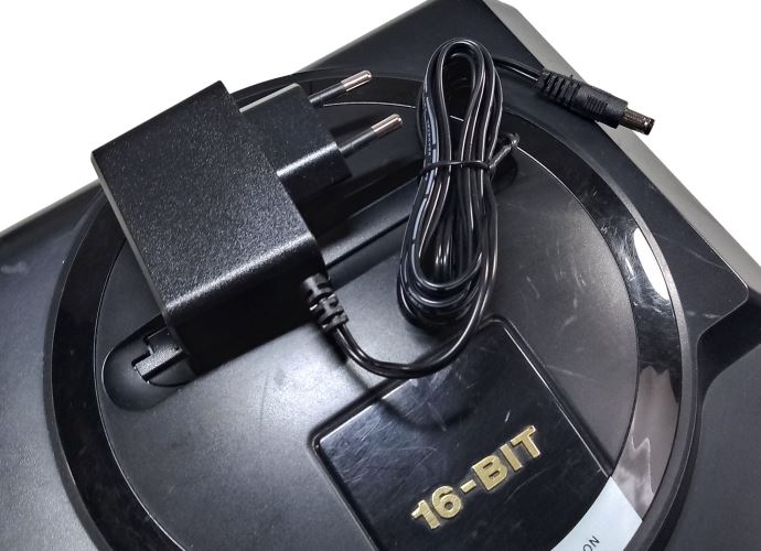 Regulated power supply for Sega Mega Drive / Genesis 1 with EU plug on top of the console